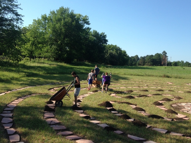 youth group placing stones